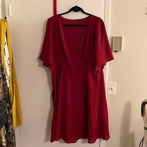 Faux wrap dress. Smoke free/pet free home. New w/tags. Knee length with pockets